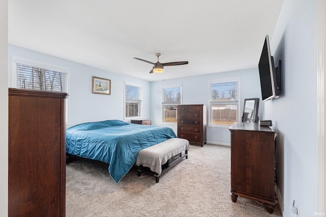 bedroom with light carpet and ceiling fan