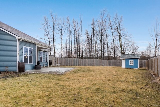 view of yard with a shed and a patio