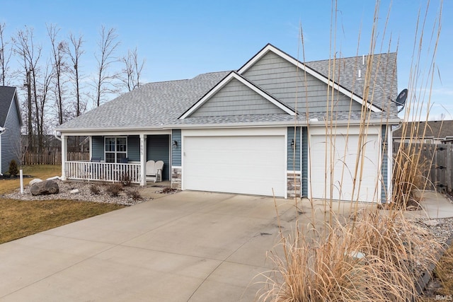 view of front of home featuring a garage and covered porch