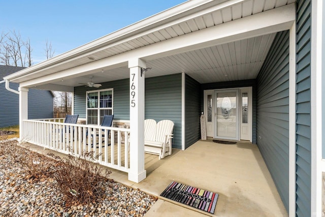 property entrance featuring a porch and ceiling fan