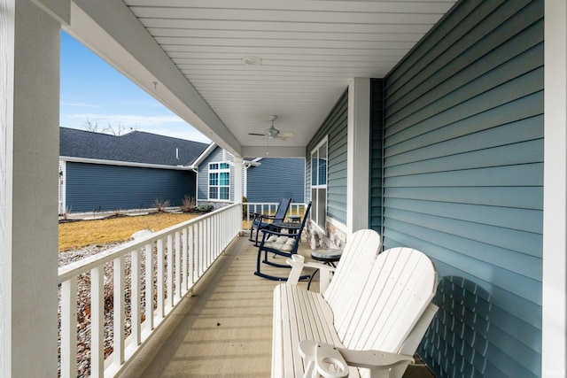 balcony featuring ceiling fan and covered porch