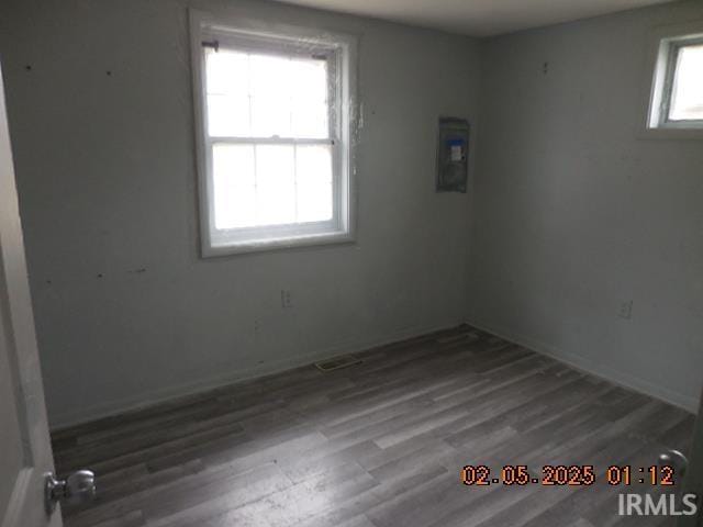 spare room featuring hardwood / wood-style flooring