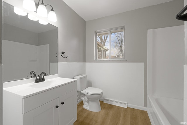 full bathroom featuring vanity, wood-type flooring, toilet, and shower / bath combination