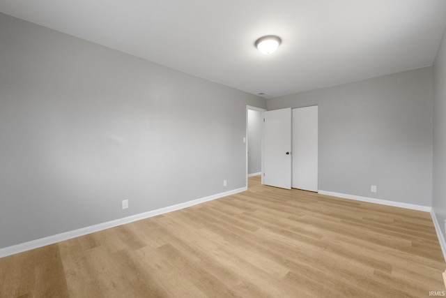 spare room with light wood-type flooring