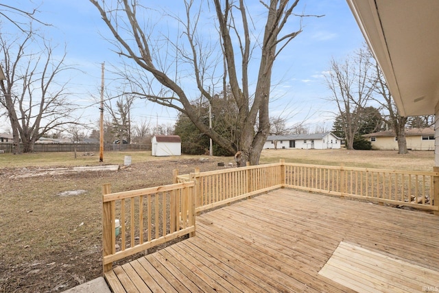 wooden deck featuring a storage shed