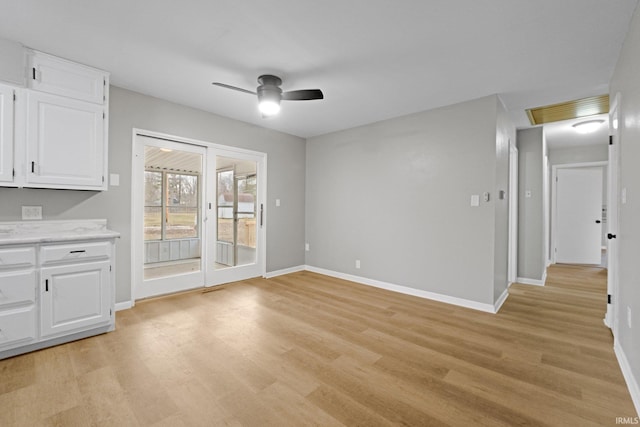 interior space featuring light hardwood / wood-style flooring and ceiling fan