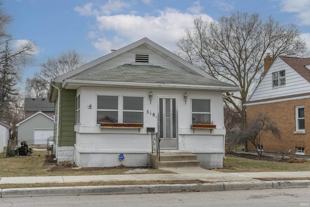 bungalow-style home with a garage