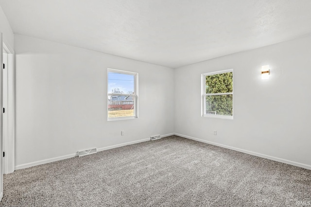 unfurnished room featuring carpet floors