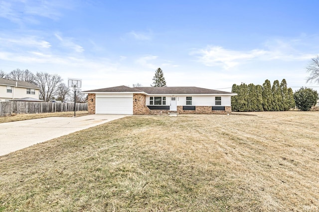 ranch-style house featuring a garage and a front yard