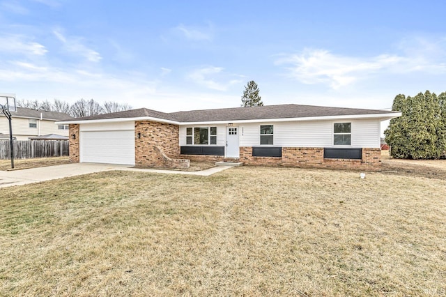 ranch-style house featuring a garage and a front lawn