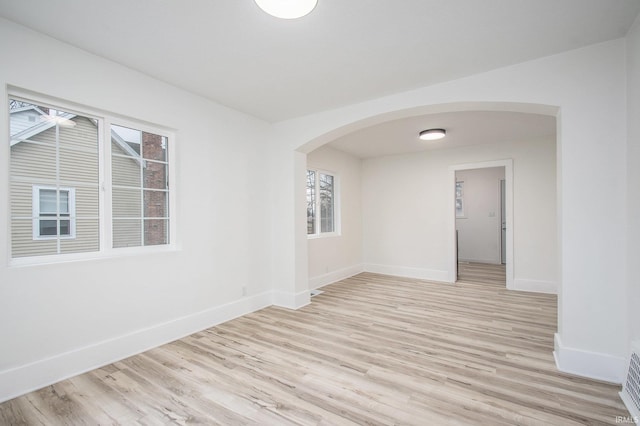 spare room featuring light hardwood / wood-style floors