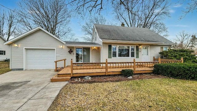 view of front of house with a garage and a front yard