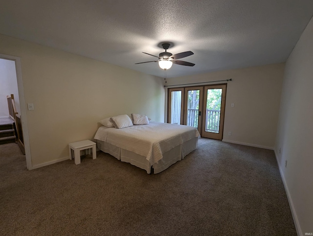 bedroom featuring access to exterior, dark carpet, a textured ceiling, and ceiling fan