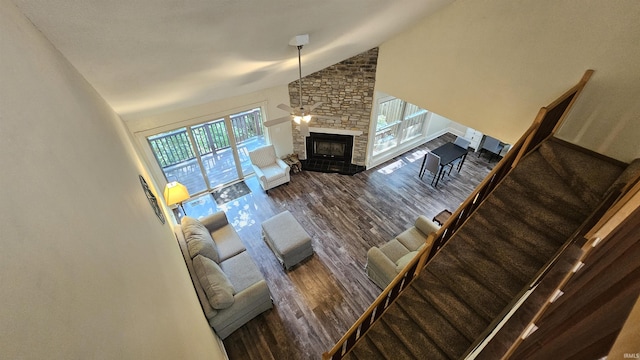 unfurnished living room with a fireplace, high vaulted ceiling, and dark hardwood / wood-style floors