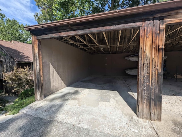 view of vehicle parking featuring a carport