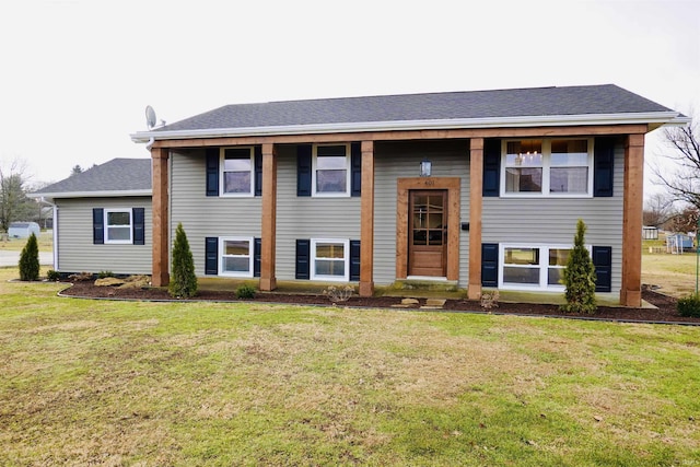 raised ranch featuring a front yard