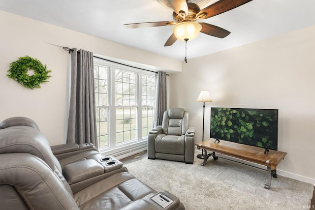 carpeted living room featuring ceiling fan