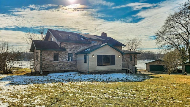 snow covered property featuring a lawn