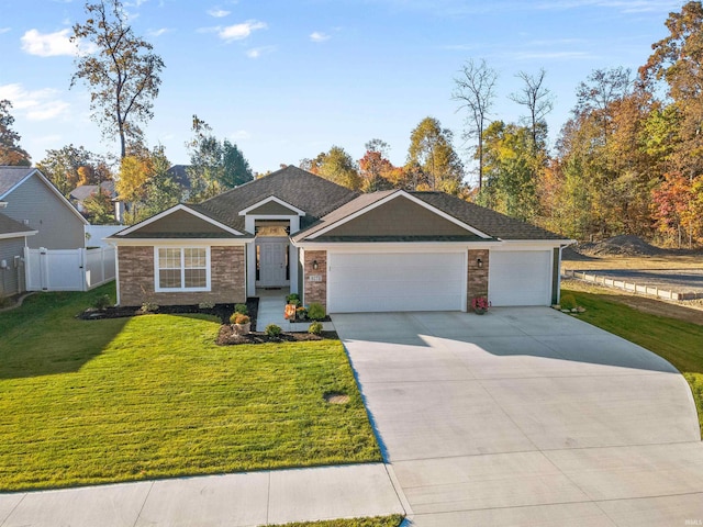 ranch-style house featuring a garage and a front lawn