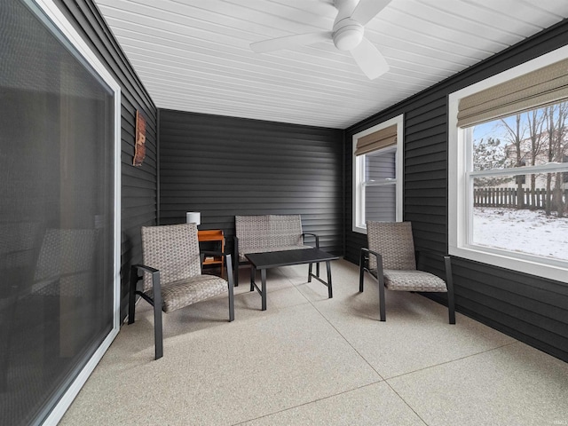 sunroom / solarium with ceiling fan