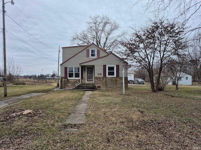 bungalow-style house with a front yard