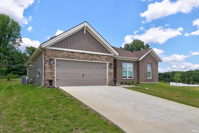 craftsman-style home featuring cooling unit, a garage, and a front yard