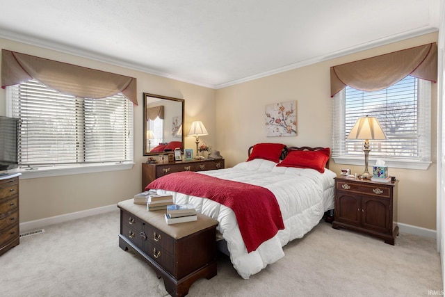 carpeted bedroom featuring multiple windows and crown molding