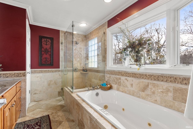 bathroom featuring plus walk in shower, tile walls, vanity, and crown molding