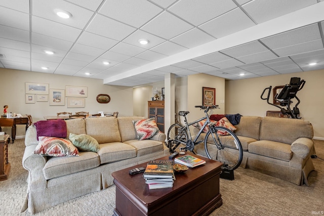 living room featuring a drop ceiling