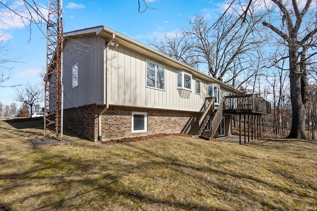 back of house with a yard and a deck