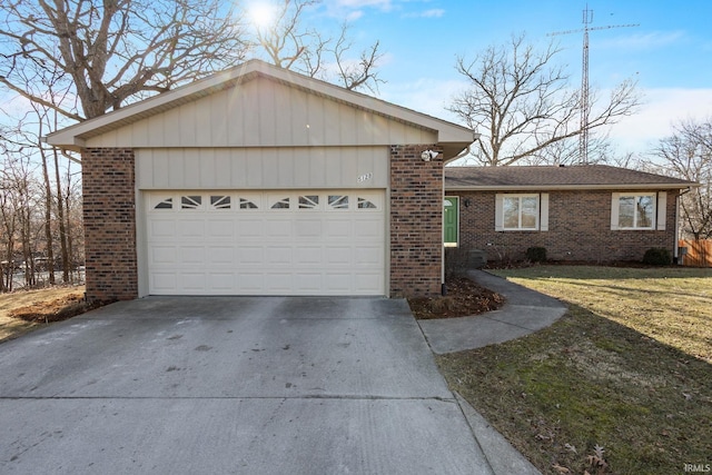 ranch-style house featuring a garage and a front yard