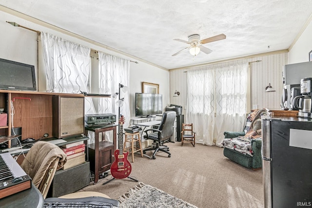 office with crown molding, light colored carpet, ceiling fan, and a textured ceiling