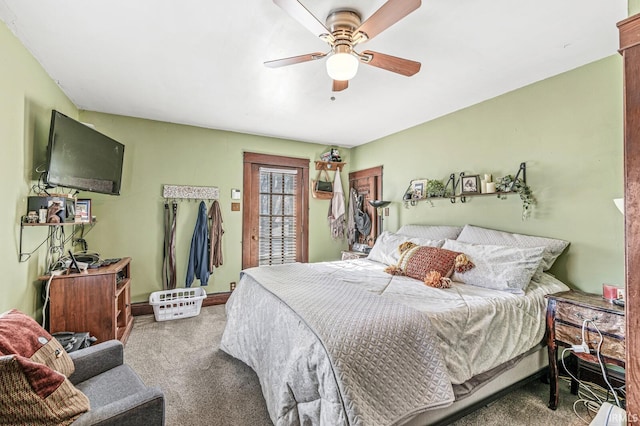 bedroom with ceiling fan and carpet