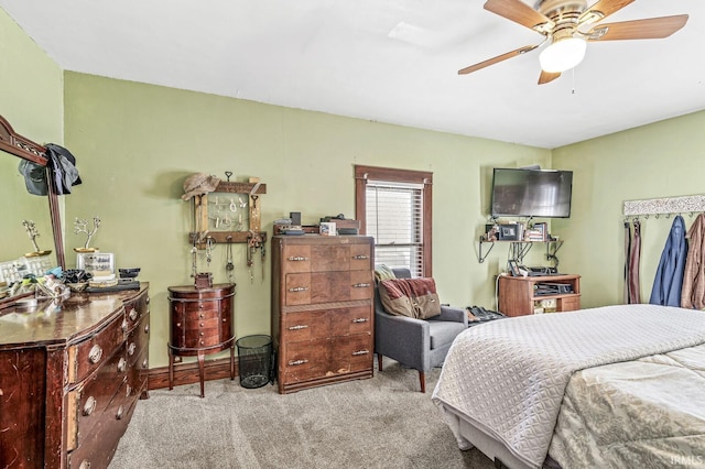 bedroom with light colored carpet and ceiling fan