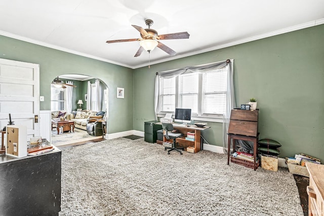 carpeted office space with ornamental molding and ceiling fan