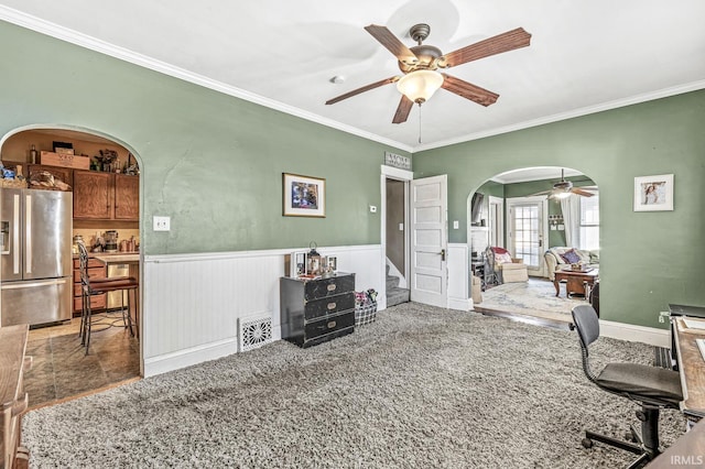 interior space featuring crown molding and ceiling fan