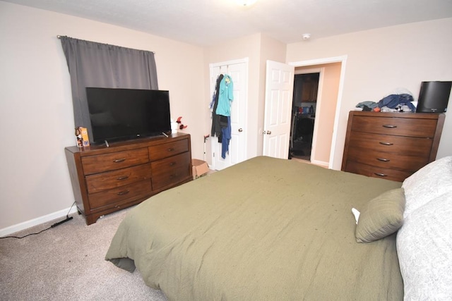 carpeted bedroom with a closet