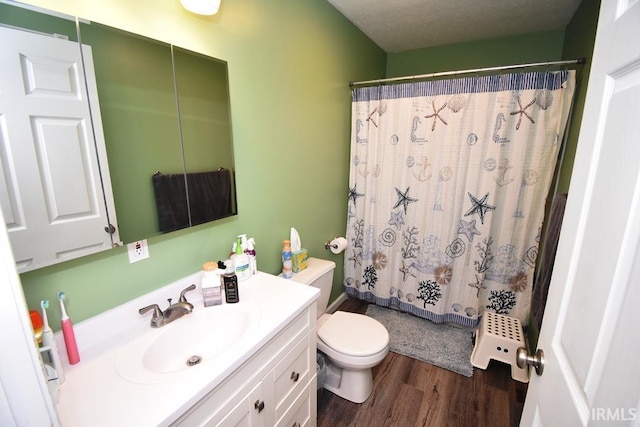 full bathroom featuring vanity, wood-type flooring, shower / bath combination with curtain, and toilet