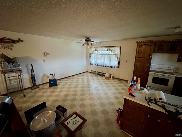 kitchen with white electric range, a textured ceiling, and ceiling fan