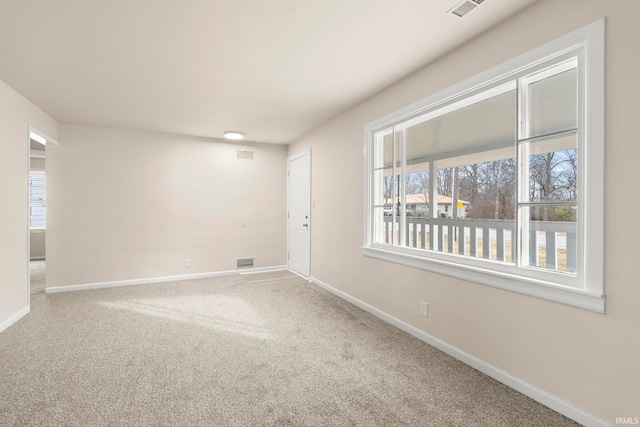 unfurnished room featuring carpet flooring