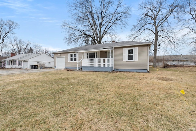 view of front facade featuring a porch, a garage, and a front lawn