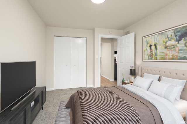 carpeted bedroom featuring a closet