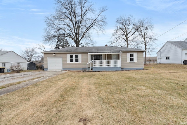 view of front of home with a porch, a garage, and a front yard