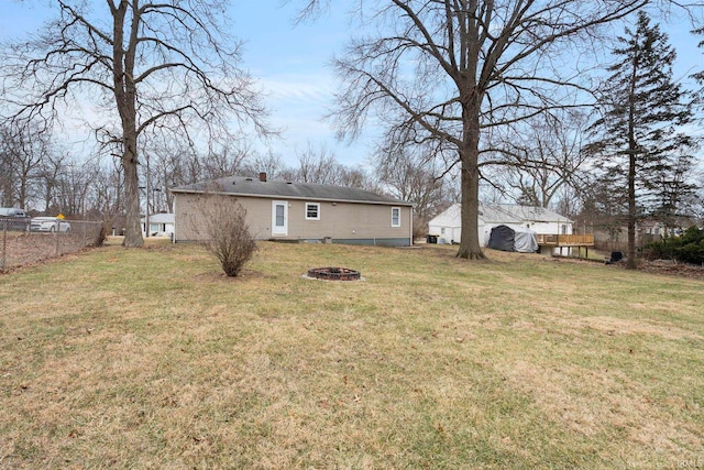 view of yard with a fire pit