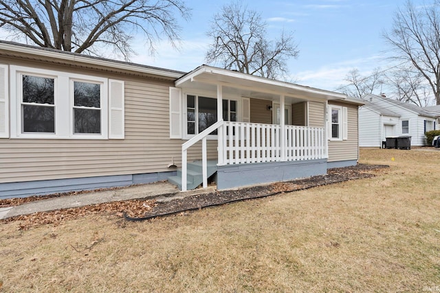 view of front of property with a front lawn and a porch