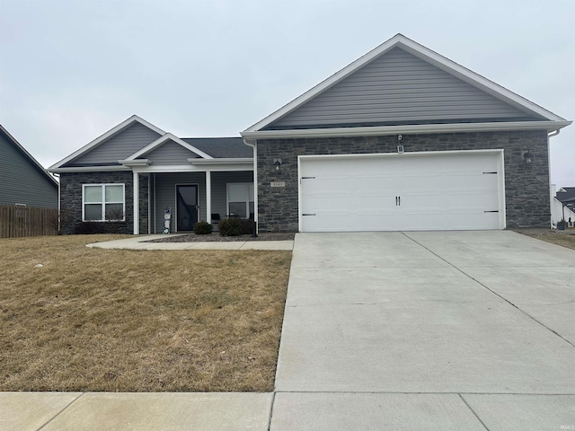 ranch-style house featuring a garage and a front lawn