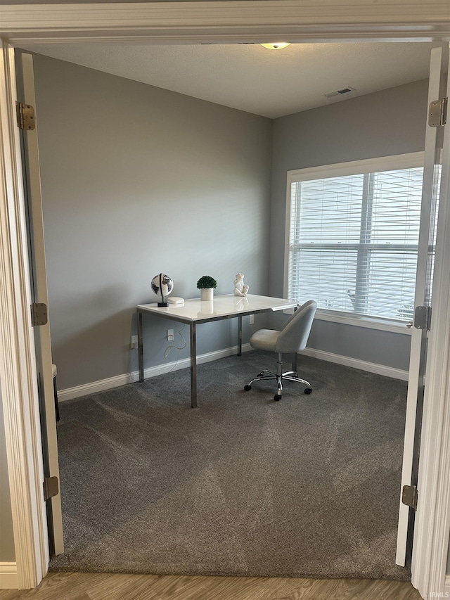 view of carpeted home office