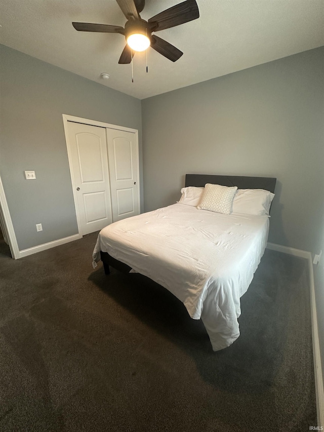 bedroom featuring a closet, ceiling fan, and dark colored carpet