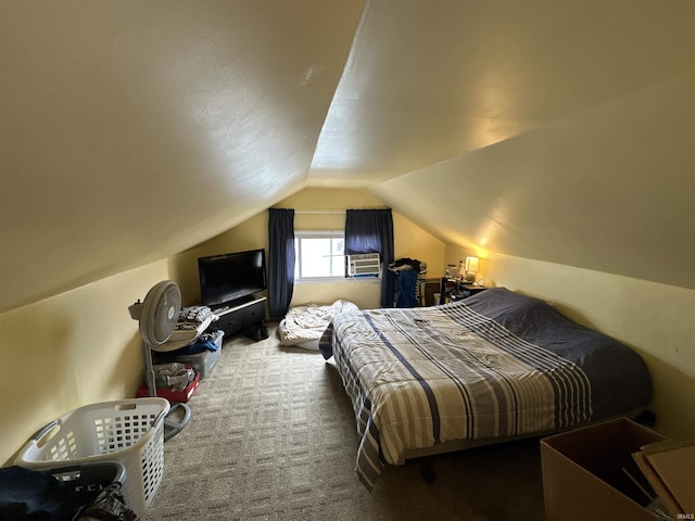 carpeted bedroom with lofted ceiling