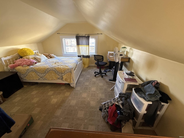 carpeted bedroom featuring lofted ceiling